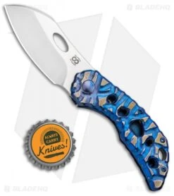 Olamic Cutlery Busker Largo Knife Blue Volcanic Ti/Funky Holes (2.5" Satin) 7 Olamic Cutlery Busker Largo Knife Blue Volcanic Ti/Funky Holes (2.5" Satin) -Blade Vault Olamic Cutlery Busker Largo Blue Volcano Ti Funky Holes Satin BHQ 91571 jr bottlecap