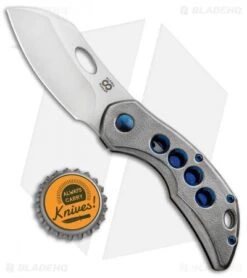 Olamic Cutlery Busker Largo Knife Orange Peel Ti / Blue Holes (2.5" Satin) 375L -Blade Vault Olamic Cutlery Busker Largo Orange Peel Ti Blue Holes Satin 375BL BHQ 93013 jr bottlecap