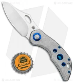Olamic Cutlery Busker Semper Frame Lock Frosty Holes Blue Accents (2.5" Satin) -Blade Vault Olamic Cutlery Busker Semper FL Frosty Holes Blue Accents Satin BHQ 115999 jr bottlecap