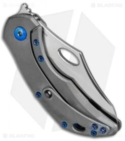 Olamic Cutlery Busker Semper Frame Lock Knife Ti W/ Blue Holes (2.5" Satin) -Blade Vault Olamic Cutlery Busker Semper FL Ti Blue Holes Satin BHQ 78927 jr side