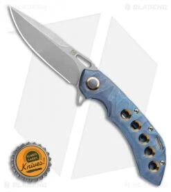 Olamic Wayfarer 247 Frame Lock Knife Blue Rock Ti/5 Hole Spear Point (3.5") -Blade Vault Olamic Wayfarer 247 Frame Lock Knife Blue Rock Ti 5 Hole Spear Point 3.5in BHQ 115556 LS Bottlecap